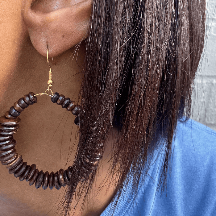 Boho Brown Wood Hoop Earrings displayed on a model's ear, showcasing natural beauty and style