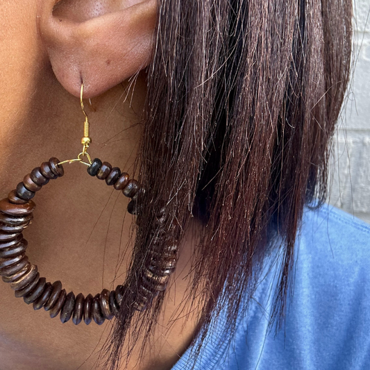 Close-up of Boho Brown Wood Hoop Earrings worn showing handcrafted wooden beads and gold hook