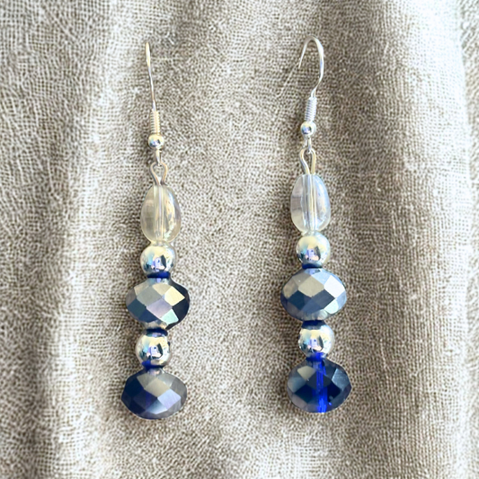 Peace N Beads Design Celestial Harmony Dual Tone Crystal Drop Earrings navy and silver faceted dangle on beige fabric