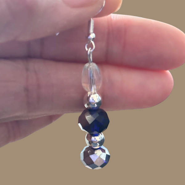 Celestial Harmony Dual Tone Crystal Drop Earrings single dangle earring with blue and silver faceted crystals
