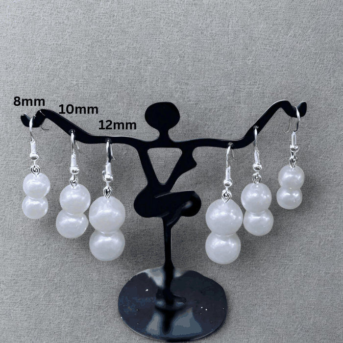 Peace N Beads Design Elegant Pearl 2 Drop Earrings in various sizes displayed on black earring stand