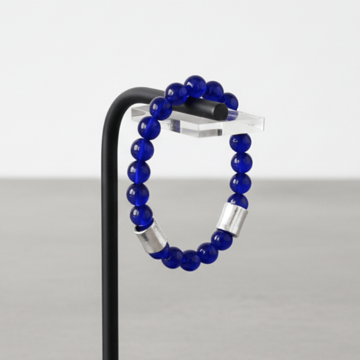 Elegant White and Blue Jade Gemstone Bracelet Set displayed on a stand for stylish men's accessories