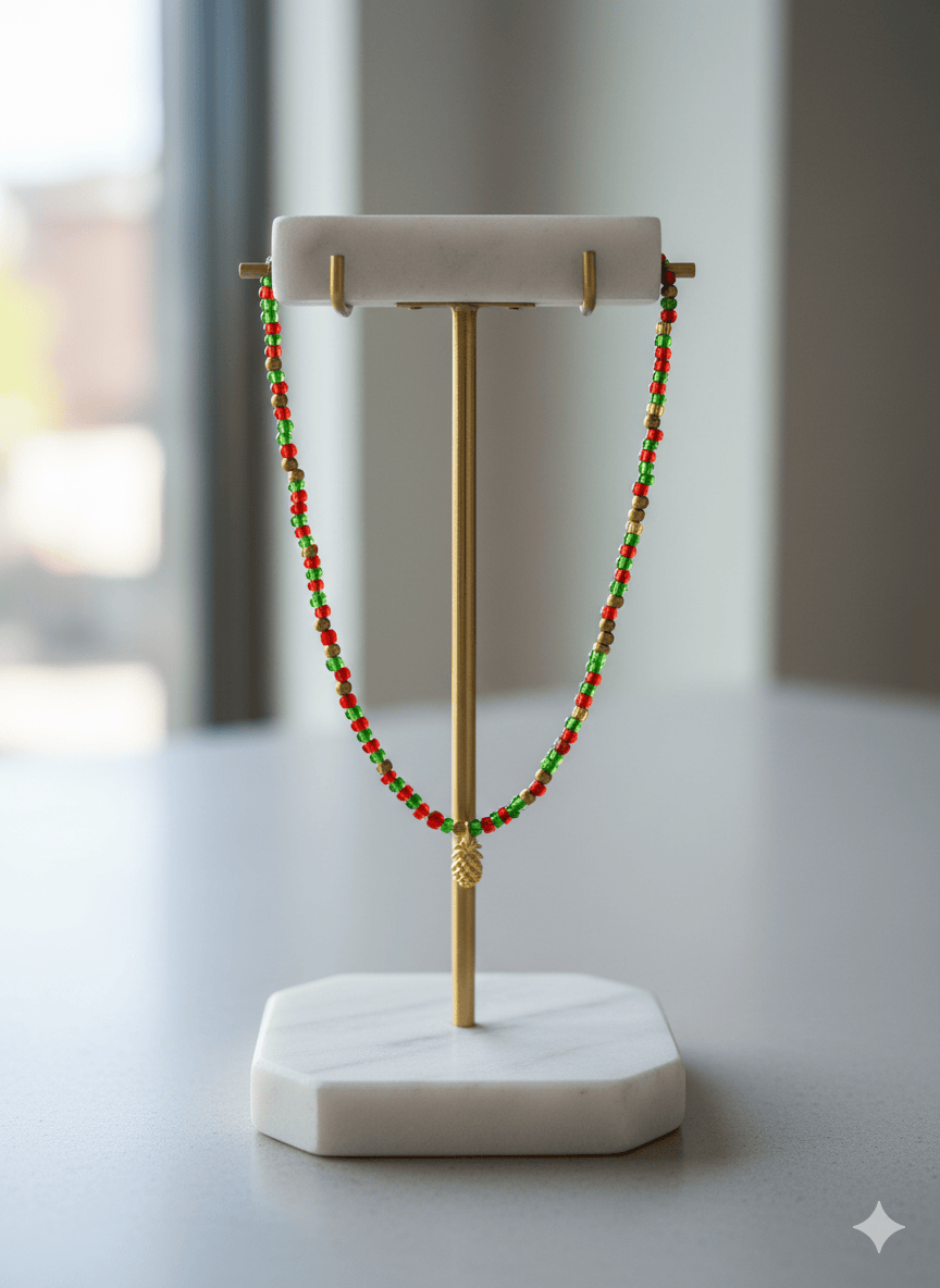 Festive Red and Green Seed Bead Necklace displayed on a stylish jewelry stand