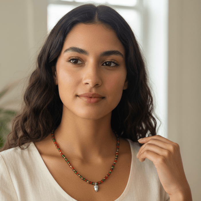 Festive Red and Green Seed Bead Necklace displayed on a model with a neutral outfit