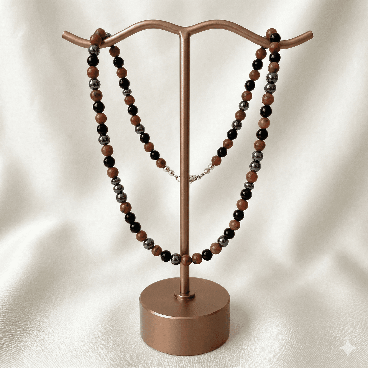 Gemstone Spiritual Protection Necklace displayed on a stylish jewelry stand with black and brown beads
