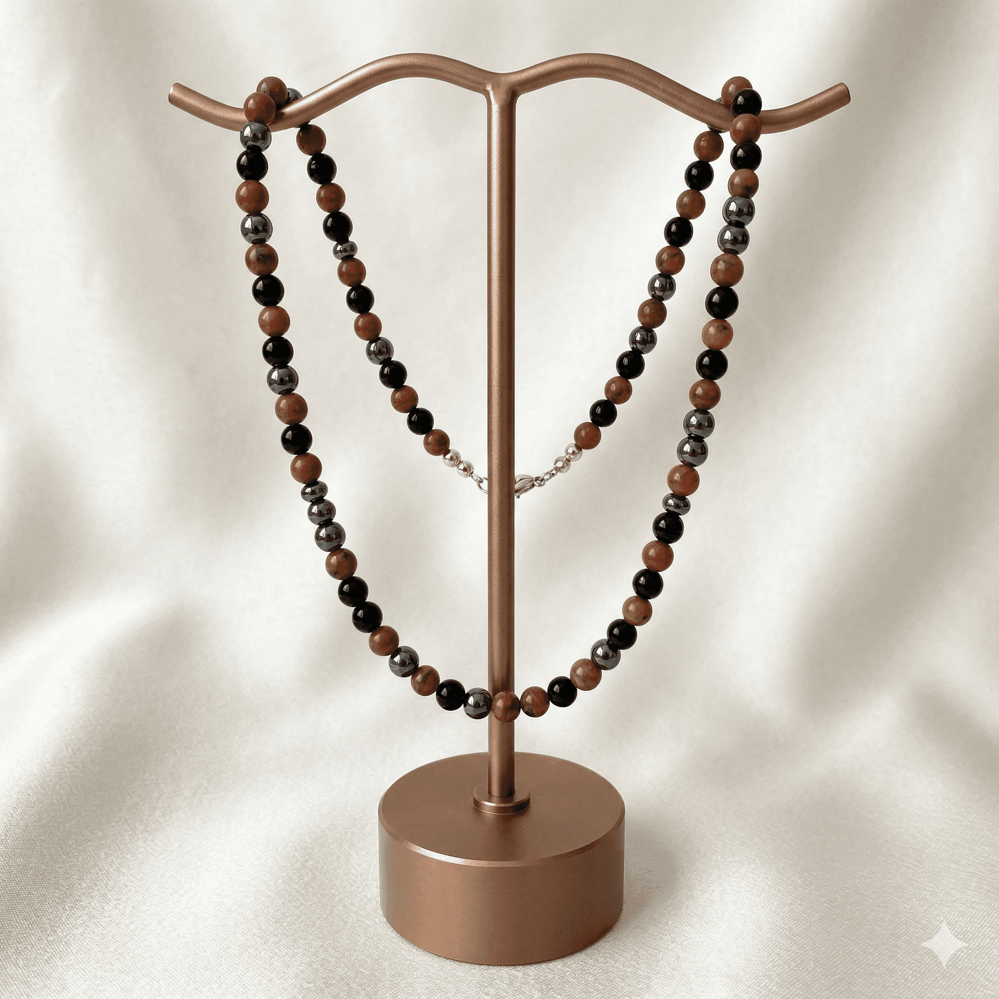 Gemstone Spiritual Protection Necklace displayed on a stylish jewelry stand with black and brown beads