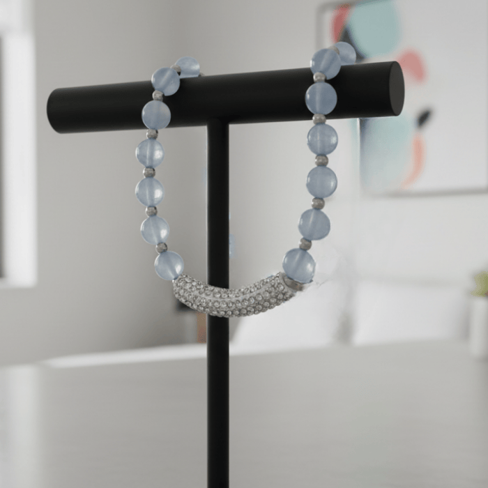 Handmade Light Blue Glass Beads with Rhinestone Accent Jewelry Set displayed on a stand