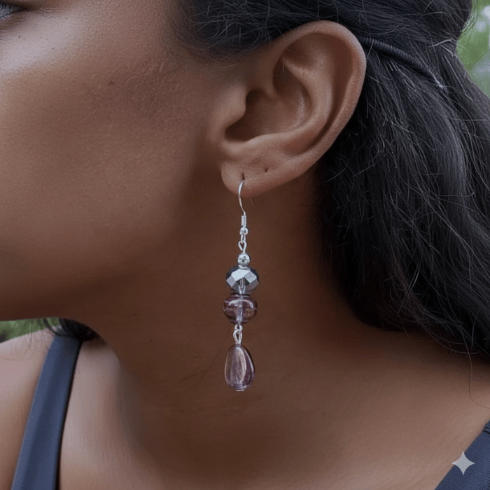 Elegant Lavender Blue Crystal and Glass Earrings dangling beautifully on a model's ear
