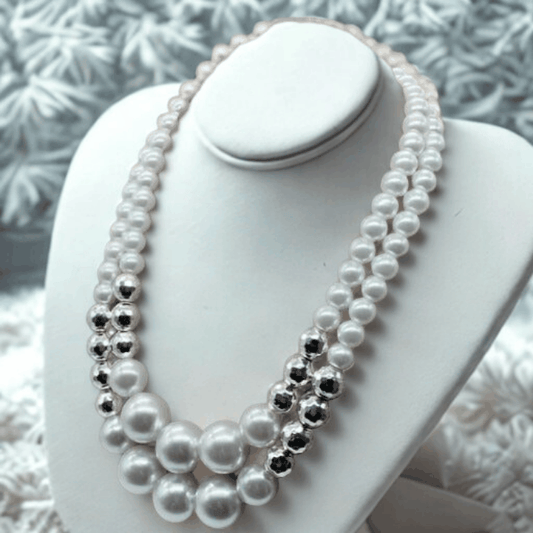 Luxurious Hematite and White Glass Pearl Necklace displayed on a white jewelry bust by Peace N Beads