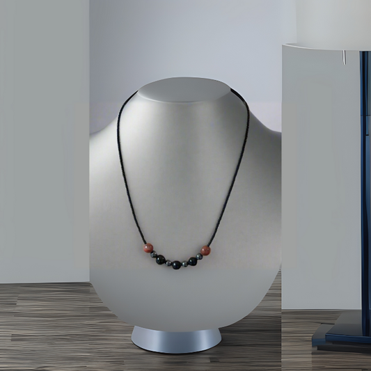 Minimalist Spiritual Protection Necklace featuring black and red beads on a sleek black cord
