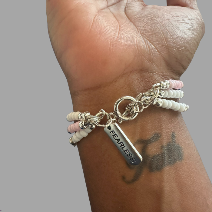 Pink Fearless Wrap Bracelet made with colorful beads and a silver charm for a stylish look