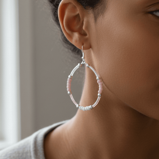 Pink Seed Bead Hoop Earrings with a Silver Hook, worn by a model