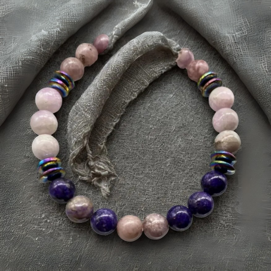 Racing Thoughts Bracelet featuring pink and purple gemstones with colorful metallic accents