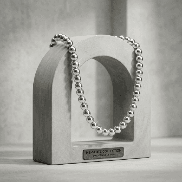 Stylish Silver Hematite Necklace displayed on a modern concrete stand from Peace N Beads Design