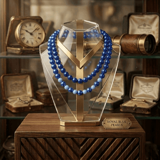 Sky and Royal Blue Double Strand Necklace displayed elegantly on a clear showcase stand