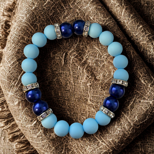 Sky and Royal Blue Stretch Bracelet featuring matte and glossy beads with sparkling accents