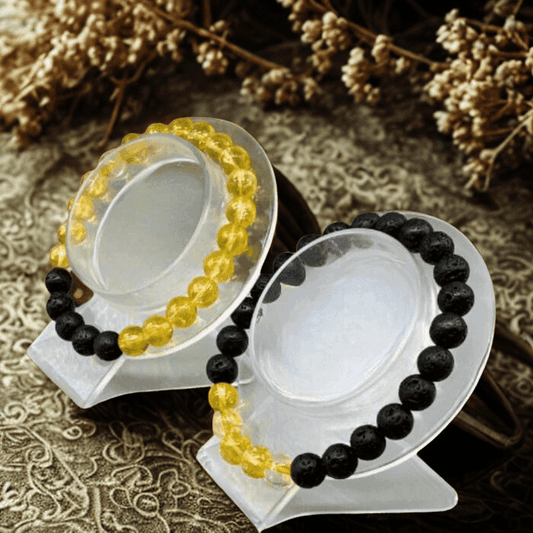 Solar plexus chakra bracelets featuring yellow and black beads for energy balance and healing