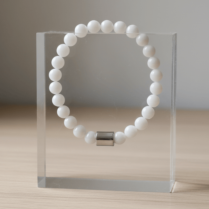 Solid White Jade Gemstone Bracelet by Peace N Beads Design featured on a clear display stand