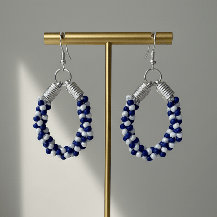 Twisted Royal Blue and White Hoop Earrings featuring intricate beadwork for a stylish look