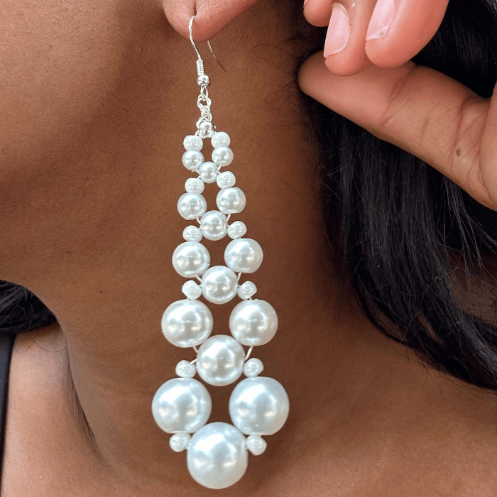 White Glass Pearl and Crystal Earrings featuring a stunning layered design for elegant style