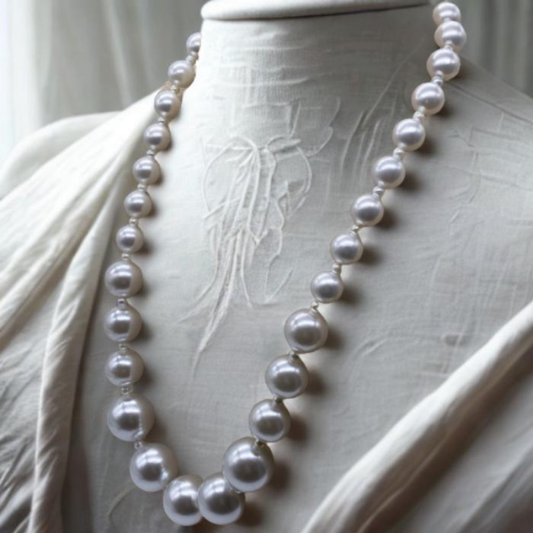 Classic 1-Strand Multi-Size Pearl Necklace by Peace N Beads displayed on a fabric mannequin