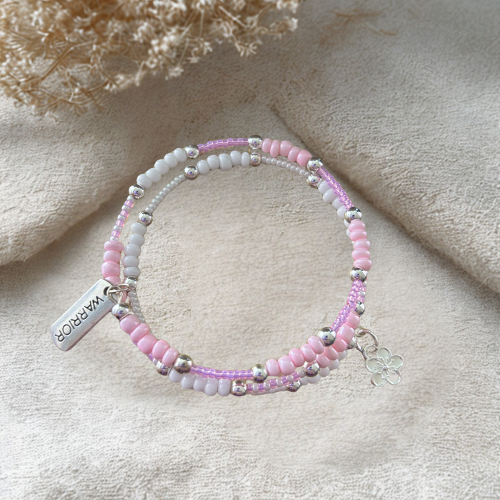 Pink Warrior Wrap Bracelet with colorful beads and a decorative flower charm