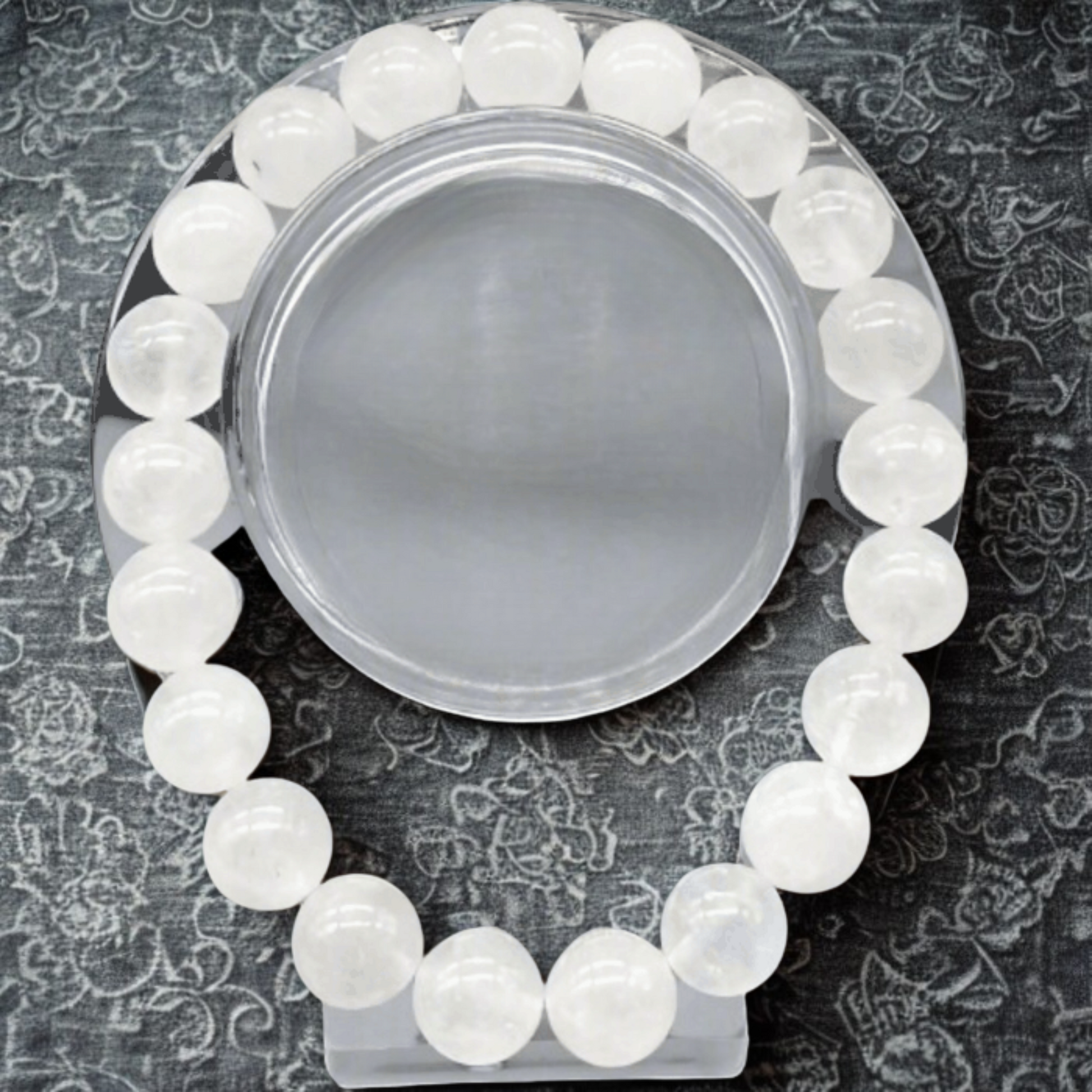 Premium White Jade Gemstone Bracelet by Peace N Beads with smooth round white beads on a black patterned background