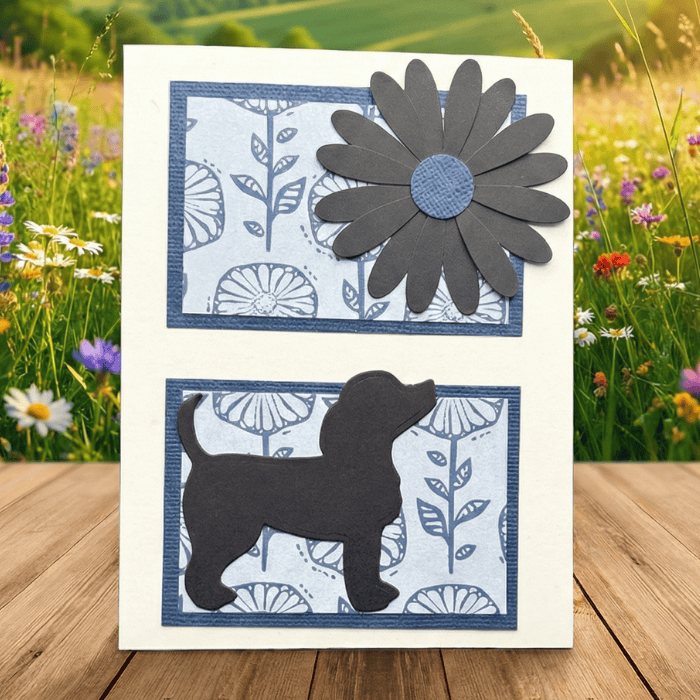Handmade note card featuring puppies in the sunshine with floral design and flower embellishment