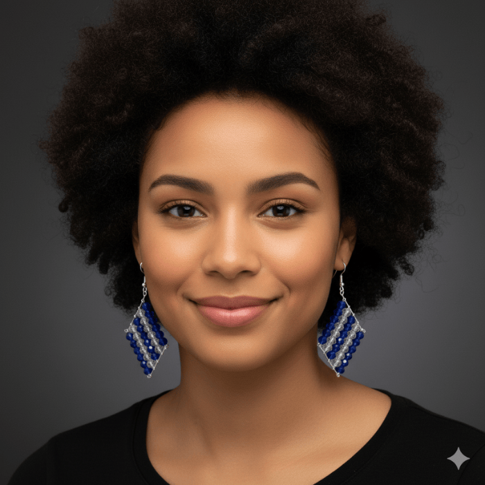 Royal Blue and Clear Crystal Drop Earrings showcased on a model with curly hair