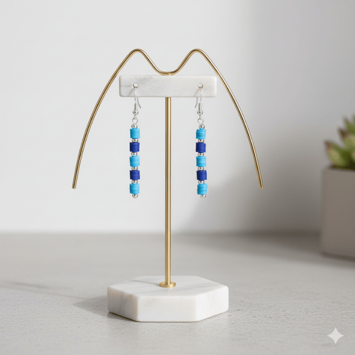 Sky and Royal Blue Drop Earrings on a stylish display stand showcasing vibrant colors