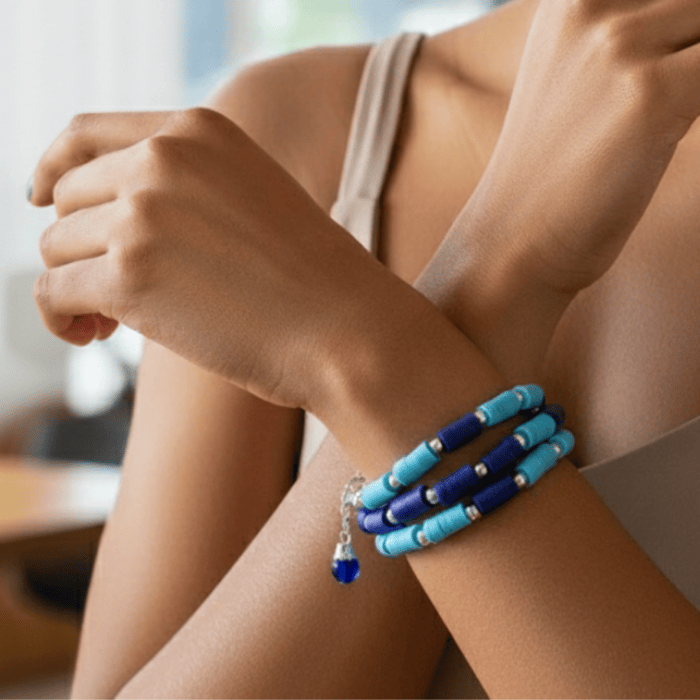 Sky and Royal Blue Three Strand Bracelet with Earrings styled on a model's wrist