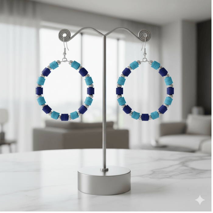 Sky and Royal Blue Three Strand Bracelet with Earrings displayed on a stand in a modern setting