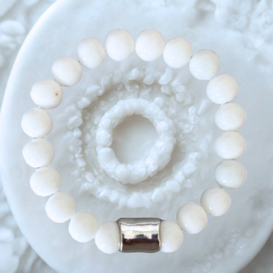 Solid White Jade Gemstone Bracelet featuring smooth beads and a silver accent for a stylish look