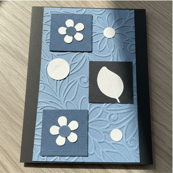 Where Flowers and Wings Unfold Note Cards featuring a unique floral design on textured blue background