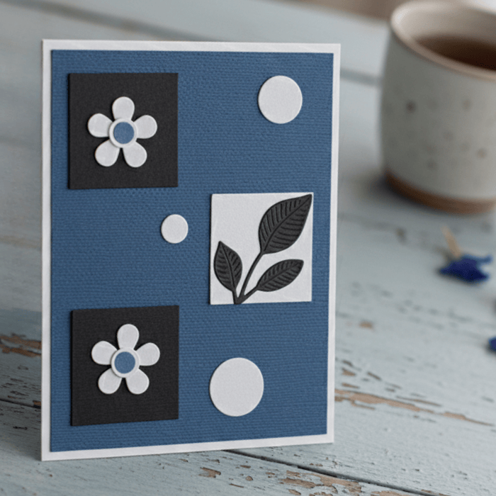 Where Flowers and Wings Unfold Note Cards featuring a blue and black floral design on textured cardstock