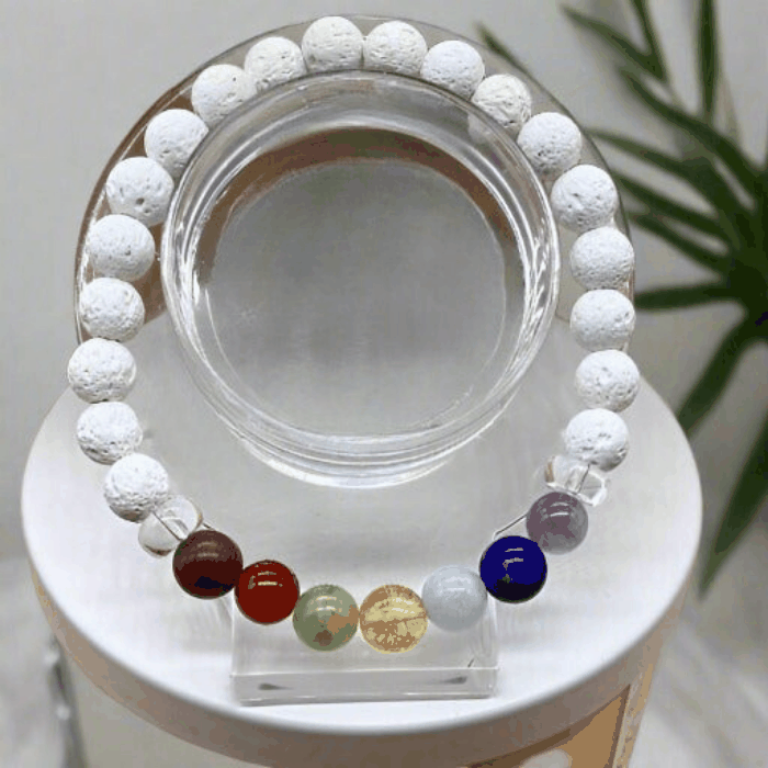 7 Bead Black Onyx Chakra Harmony Bracelet with Multicolored Gemstones on Display